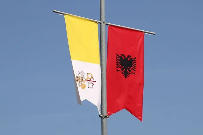 Papal and Albanian banners line Albania's streets. ?w=200&h=150