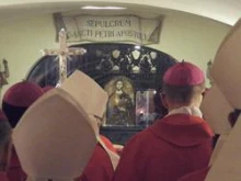 The bishops of Pennsylvania and New Jersey pray in front of St. Peter's tomb in the crypt of St. Peter's Basilica on Dec. 1, 2011