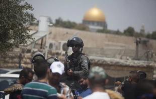 An Israeli border police officer is seen during a Friday prayer in the Ras el-Amud Area outside the Old City of Jerusalem, July 21, 2017.   Lior Mizrachi/Getty Images.