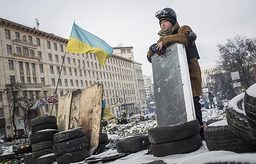An anti-government protestor stands on top of a barricade on Grushevskogo Street Jan. 29, 2014 in Kiev, Ukraine. ?w=200&h=150