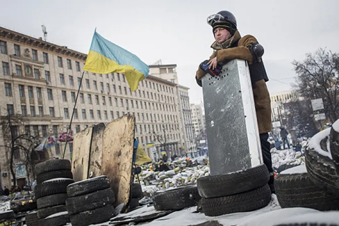 An anti government protestor stands on top of a barricade on Grushevskogo Street Jan 29 2014 in Kiev Ukraine Credit Rob Stothard Getty Images News Getty Images CNA 2 12 14