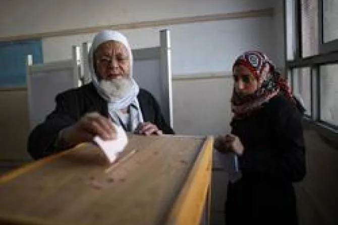 An election official R watches as an elderly man votes at a polling station in Old Cairo Credit Peter Macdiarmid Getty Images News Getty Images CNA World Catholic News 12 1 11