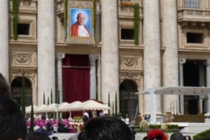 An image of Bl Pope John Paul II hangs above St Peters Square during his beatification May 1 2011 CNA Vatican Catholic News 5 2 12