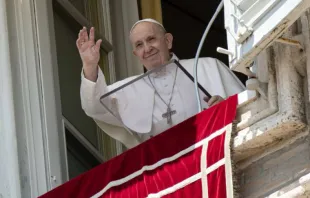 Pope Francis waves from his window overlooking St. Peter’s Square during an Angelus address.   Vatican Media.