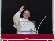Pope Francis greets the crowd gathered in St. Peter's Square during his Angelus address on August 9, 2015. 