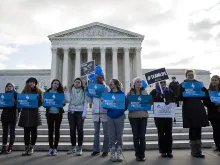 Anti-abortion advocates stand outside of the Supreme Court, March 2, 2016 in Washington, DC during abortion arguments. 