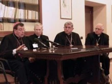 Msgr. Robert Stern (center) speaks at a press conference during the Synod for the Middle East