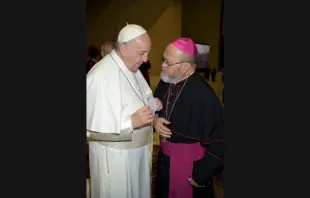 Archbishop Anthony Apuron greets Pope Francis Feb. 7, 2018.   Vatican Media.