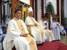 Archbishop Charles Bo of Yangon (center) says Mass in this undated file photo. 