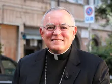 Archbishop Charles Chaput and the World Meeting of Families catechesis book in Rome on Sept. 15, 2014. 