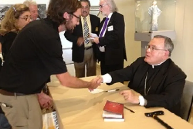 Archbishop Charles Chaput signs copies of his book in the cathedral conference center lobby following the LA Prayer Breakfast Credit Archdiocese of Los Angeles CNA 9 18 12