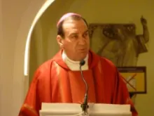 Archbishop Dennis M. Schnurr of Cincinnati delivers a homily at the tomb of St. Peter in Feb. 2012. CNA File Photo.