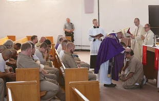 Bishop James Conley of Lincoln gives Confirmation to a prisoner during a Mass said at the Nebraska State Penitentiary, March 31, 2015. Photo courtesy of the Southern Nebraska Register.