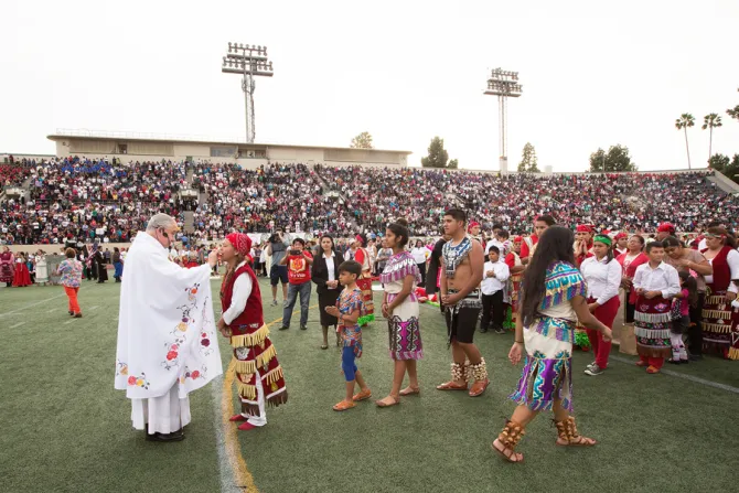 Archbishop Jos Gomez distributes Communion during Mass in Weingart Stadium at East Los Angeles College Credit Victor Alemn Angelus News CNA 12 12 14
