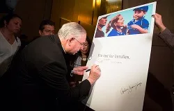 Archbishop José H. Gomez of Los Angeles signs a board showing his commitment to fasting for families, Nov. 26, 2013. ?w=200&h=150