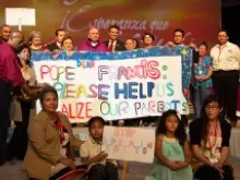 Archbishop Jose Gomez of Los Angeles poses with immigration reform advocates at the 2014 Religious Education Congress. 