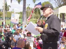 Archbishop Thomas Wenski speaks at a rally on immigration in Miami on April 6, 2013. 