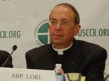 Archbishop William Lori of Baltimore, who is also the US bishops' religious liberty committee chair, speaks at a news conference in Baltimore, Nov. 11, 2013. 