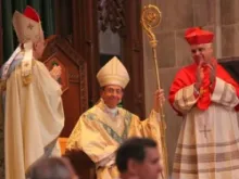 Archbishop William E. Lori sits for the first time in his cathedra at Baltimore's Cathedral of Mary Our Queen on May 16, 2012. 