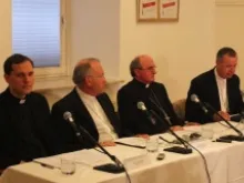 Archbishops Anton Stres (left in white) and Marjan Turnsek (right in white) appear July 31, 2013 to announce their resignations. 