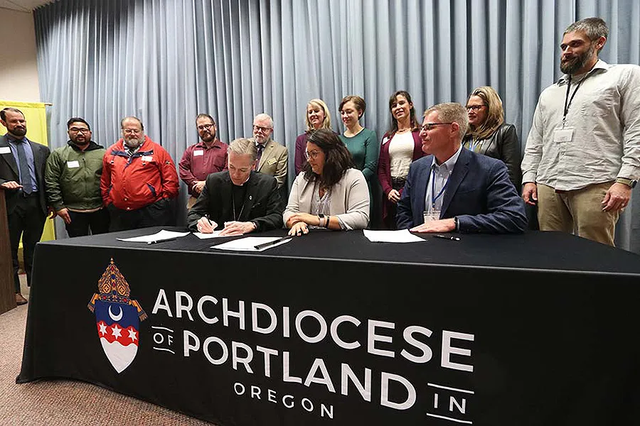 Archbishop Alexander Sample of Portland signs a memorandum of understanding with Young Life. ?w=200&h=150