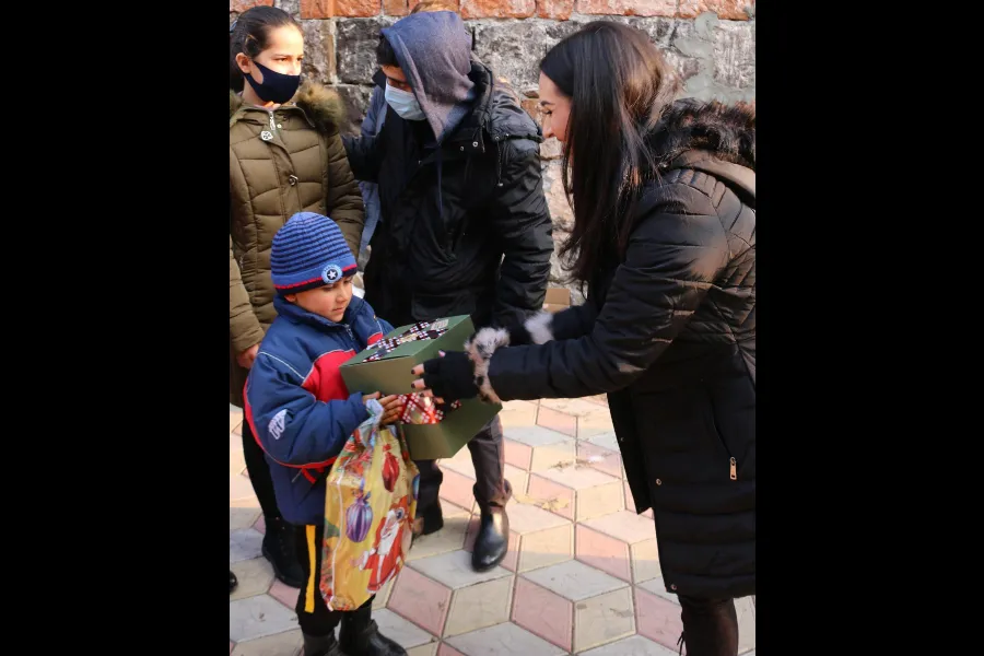 Gia Chacón, organizer of Operation Christmas for Armenia, distributes presents. Photo courtesy of For the Martyrs.?w=200&h=150