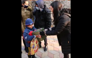 Gia Chacón, organizer of Operation Christmas for Armenia, distributes presents. Photo courtesy of For the Martyrs. 