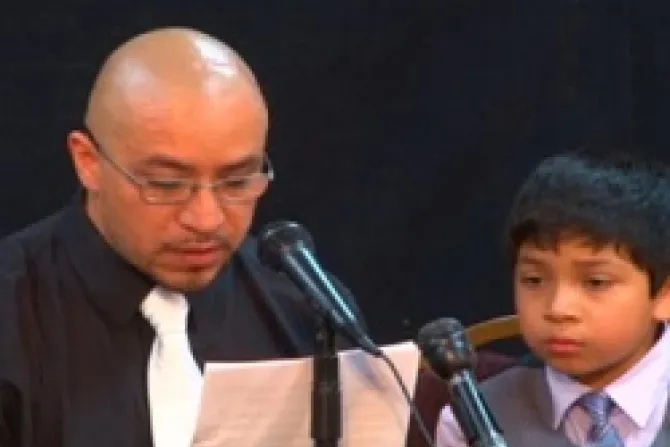 Arturo Martinez Sanchez reads a statement at the press conference with one of his sons CNA US Catholic News 7 17 12