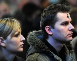 Two young people participating in an Ash Wednesday Service in Westminster Cathedral. ?w=200&h=150