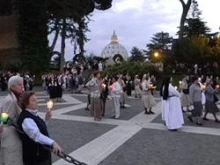 Participants waiting for Pope Benedict XVI at the Vatican's Lourdes Grotto in 2010.
