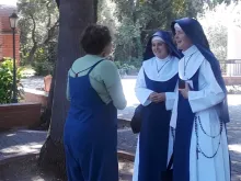 Mary Ann Carr-Wilson greets the Marian Sisters of Santa Rosa before the Teaching Children's Chant Camp Workshop in Menlo Park, Calif., held last week. Photo courtesy of the Benedict XVI Institute.