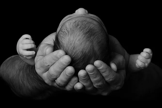 Baby in parents arms Credit geliatida Shutterstock CNA