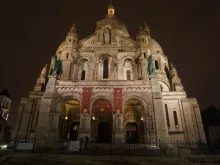A night view of Sacré-Cœur Basilica in Paris, France. 