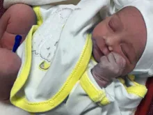 A newborn child rescued from a sentence of death in northern Iraq. 