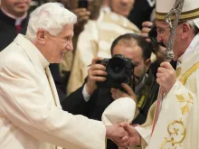 Benedict XVI greets Pope Francis during a consistory in St. Peter's Basilica, Feb. 22, 2014. 