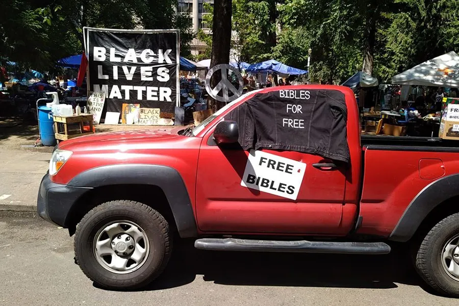 Bibles for Free truck in Portland, parked near the center of the recent protests. Courtesy of Alan Summerhill.jpg?w=200&h=150