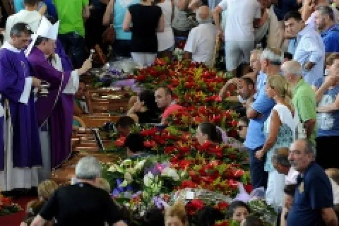 Bishop Gennaro Pascarella blesses the coffins of the 38 bus crash victims on July 30 2013 ANSAEttore FerrariCNA