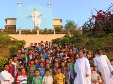 Bishop George Pallipparambil (2R) with pilgrim students at the Light of the World Cathedral in Miao, India. 