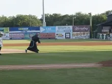 Bishop Gregory J. Hartmayer, OFM Conv., of Savannah throws out the first pitch at Grayson Stadium on June 4, 2014. 