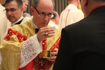 Bishop James D Conley gives communion during his installation as the ninth bishop of Lincoln NE on Nov 20 2012 Credit Seth DeMoor CNA US Catholic News 4 1 15
