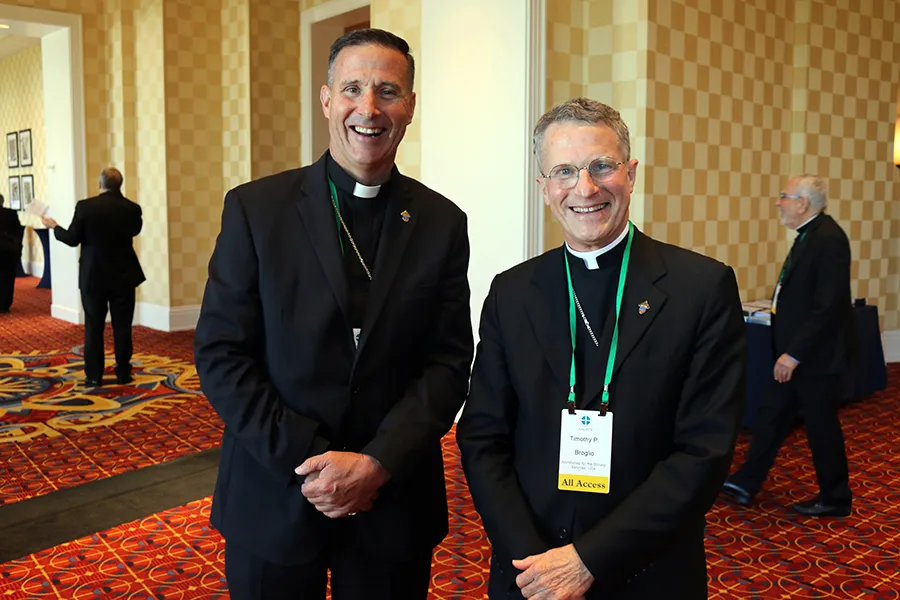 Newly-consecrated Bishop Joseph Coffey (L) with his ordinary, Archbishop Timothy Broglio of the Military Services, at the USCCB General Assembly in Baltimore, June 12, 2019. ?w=200&h=150