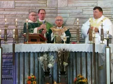 Bishop David Kagan of Bismarck, Bishop John Folda of Fargo, and Fr. Adam Maus say Mass, assisted by Dn. Dennis Dean, at St. John in Lansford, N.D., Aug. 19, 2018. Courtesy of the Bismarck diocese.  