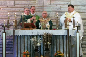 Bishop Kagan celebrated Mass at St John in Lansford with Fargo Dioceses Bishop Folda Deacon Dennis Dean far left and Pastor Adam Maus Photo courtesy diocese of Bismarck CNA