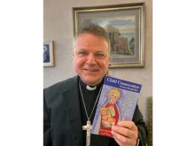 Bishop John Keenan of Paisley holds 'Child Consecration: To Jesus Through Mary'. 