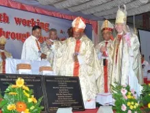 Bishop Machado (L) and Papal Nuncio Arcbishop Salvatore Pennaccio (R) bless a new Church foundation stone. 