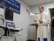 Bishop Michael Burbidge of Arlington blesses the new ultrasound machine for the Mother of Mercy Free Clinic in Manassas, Va., Jan. 14, 2019. Photo courtesy of Joe Cashwell for the Catholic Herald.
