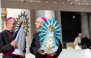 Bishop Paul Mason of the UK Armed Forces (L) and Bishop Santiago Olivera of the Argentine Armed Forces hold statues of Our Lady of Lujan in St. Peter's Square, Oct 30, 2019.   Daniel Ibanez/CNA.
