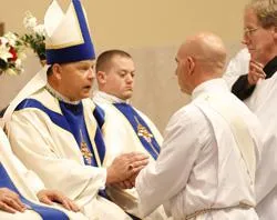 Bishop Richard F. Stika receives promises of respect and obedience from soon-to-be-ordained Douglas Owens during a May 28 Mass at Sacred Heart Cathedral. Photo ?w=200&h=150