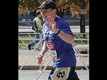 Bishop Thomas John Paprocki waves as he completes the St. Louis Rock-N-Roll Marathon on Oct. 21. Photo courtesy of the National LIFE Runners team.