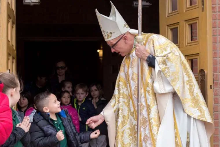 Bishop James Wall greets young parishioners in the Diocese of Gallup. Courtesy photo?w=200&h=150